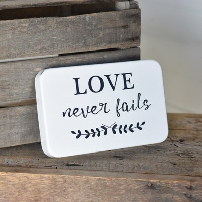 Love Never Fails tin sign